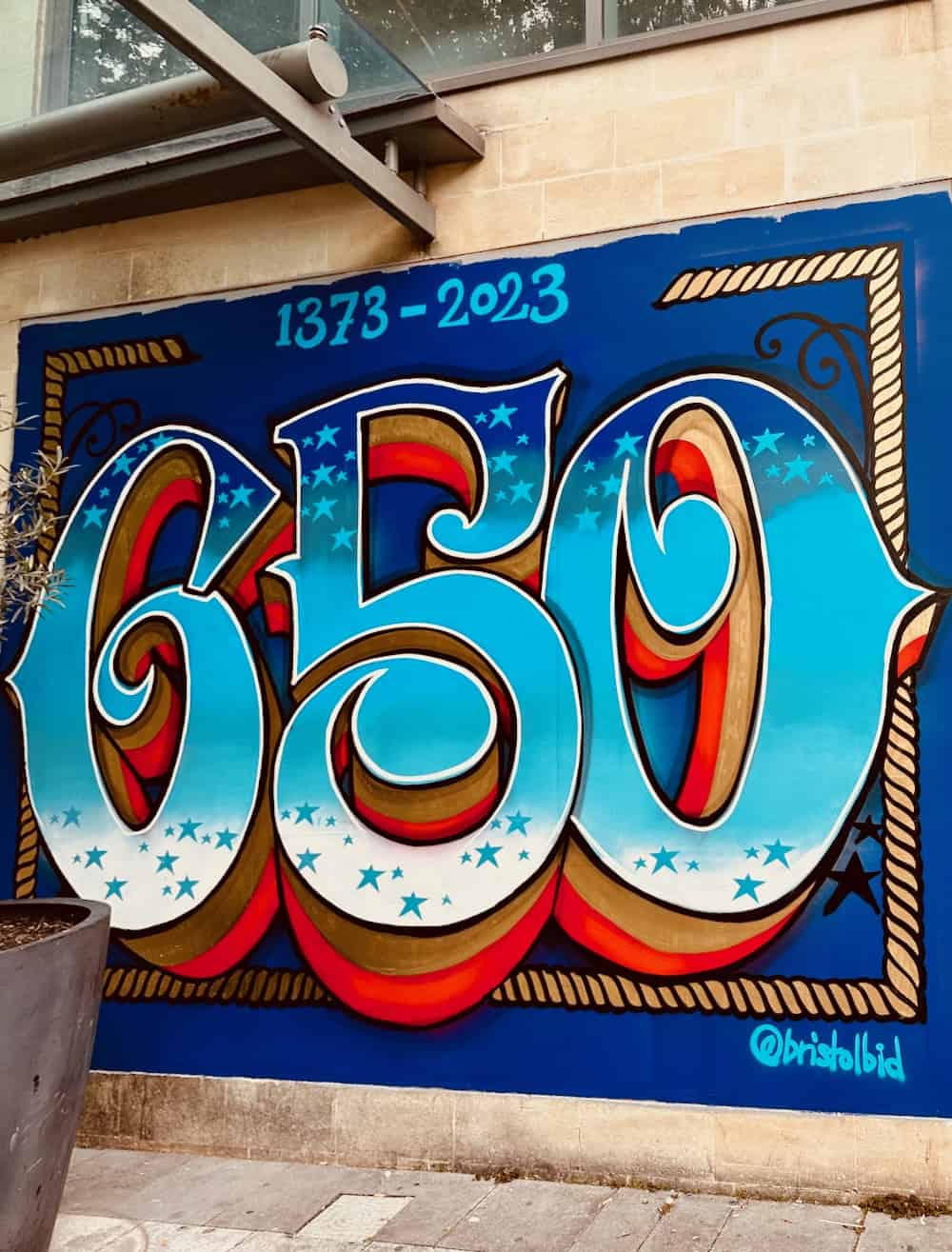 Bristol 650 logo painted onto a wall in the centre. Marking 650 years from 1373 to 2023 since Bristol became a city and a county.