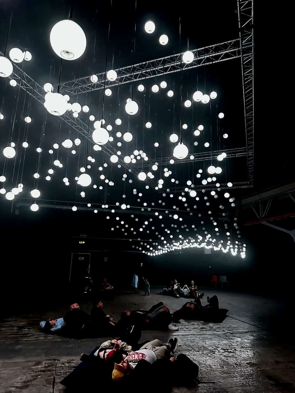 People relaxing on the floor watching the light patterns above them at Squidshow's Beyond Submergence Exhibition at Propyard. 
Check out the rest of the guide for loads more info about what's on in Bristol this summer!